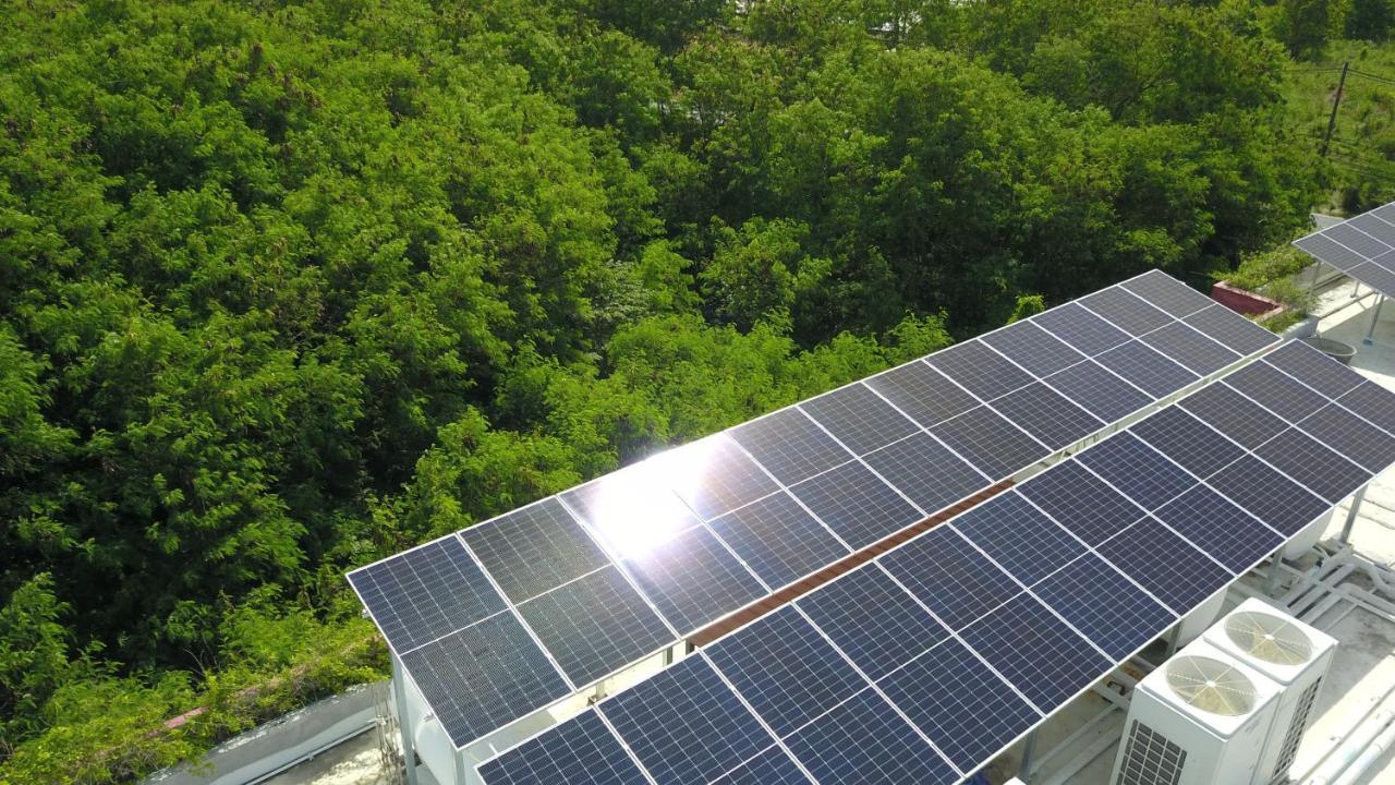 Le Resort And Villas Rawai Екстериор снимка Solar panels on the roof of the school